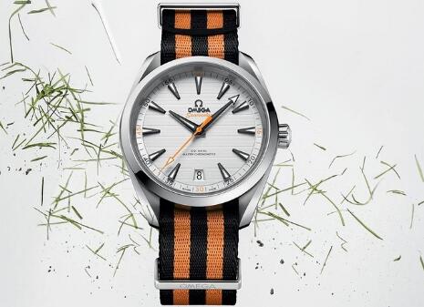 The orange and black NATO strap matches the black and orange elements on the dial well.
